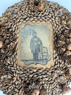 Unusual Civil War soldier tintype in an Acorn & seed tramp art style frame